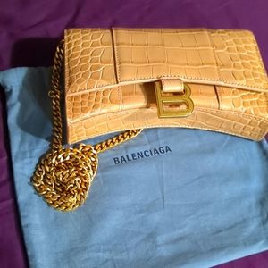 Balenciaga tan hourglass clutch with gold chain